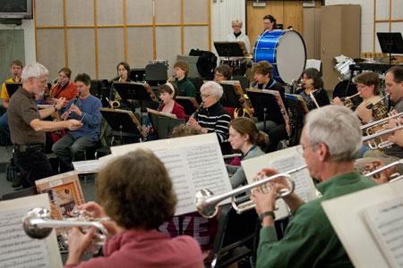 Band director Paul Husby leads the community band during a rehearsal.