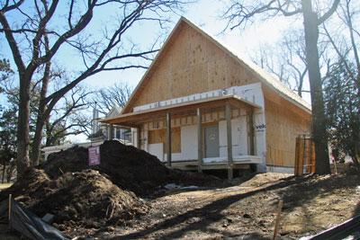 A front porch and an
exterior made of traditional lapsiding
and cedar shakes will help the
house blend in with its neighbors.