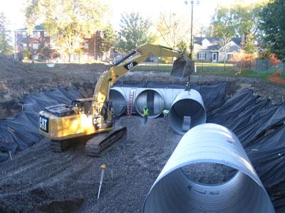 Installation of the piping system under Curtiss Field. Photo courtesy of Capitol Region Watershed District