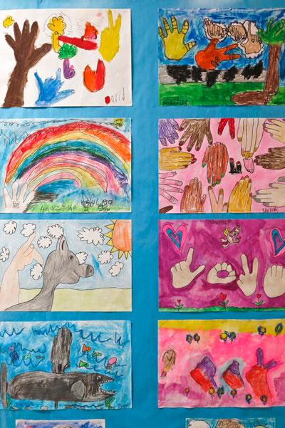 An art project created by Metro Deaf School elementary students
merges images and American Sign Language (ASL) signs. Photo by
Lori Hamilton