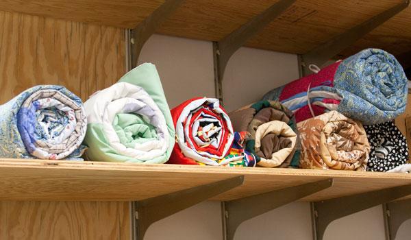 The shelf was filling up with finished quilts by mid-October.