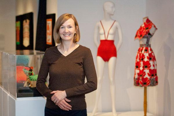 Goldstein Museum associate curator Jean McElvain drew up the initial list of items to choose among for the 40th anniversary exhibit. McElvain stands before the Rudy Gernrich monokini. Photo by Lori Hamilton