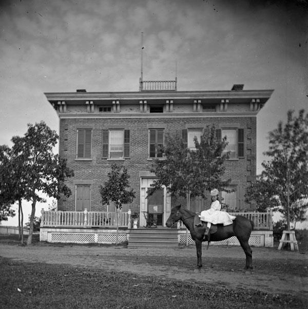 The young lady on horseback is probably Josephine McKenty, posing in front of the fine home that her father built on the shore of the lake he renamed Como. Photo courtesy of Minnesota Historical Society