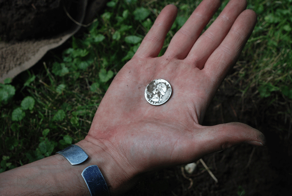 Torok knew he’d found a silver quarter when he saw the shiny sliver protruding from the earth. Moments later he confirmed it. 
