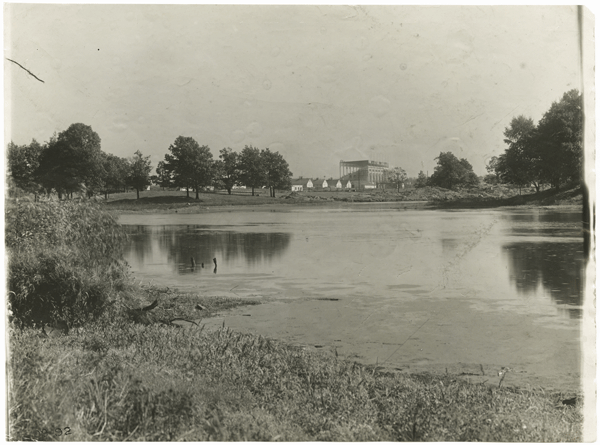 In this view of the wetland from around 1910, there appears to be dredged material on the far bank. The Minnesota State Fair’s new grandstand is in the background. Photo courtesy of the Minnesota Historical Society 