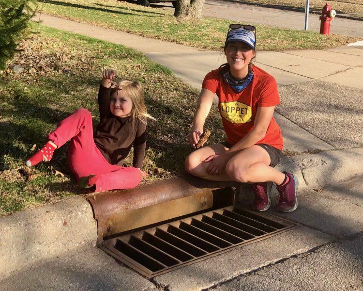 Volunteer with Adopt-a-Drain and
you can name your own storm drain. Here, Allie and daughter
clean “Rosemary’s Drain.” Photo
by Allie Rykken.