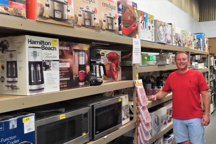 Tim Keehn, co-owner of Sky Group Inc. in St. Anthony Park, in an aisle of the company’s retail outlet store, Sky Group Bargains. Photo by Cigale Ahlquist