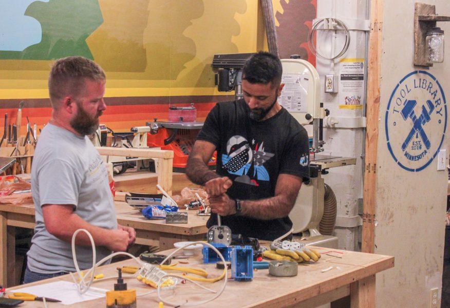 A Minnesota Tool Library member and class instructor Evan Mathiason
are working on a rowboat in the Saint Paul makerspace as part of the spring 2021 project series. Photo courtesy Minnesota Tool Library