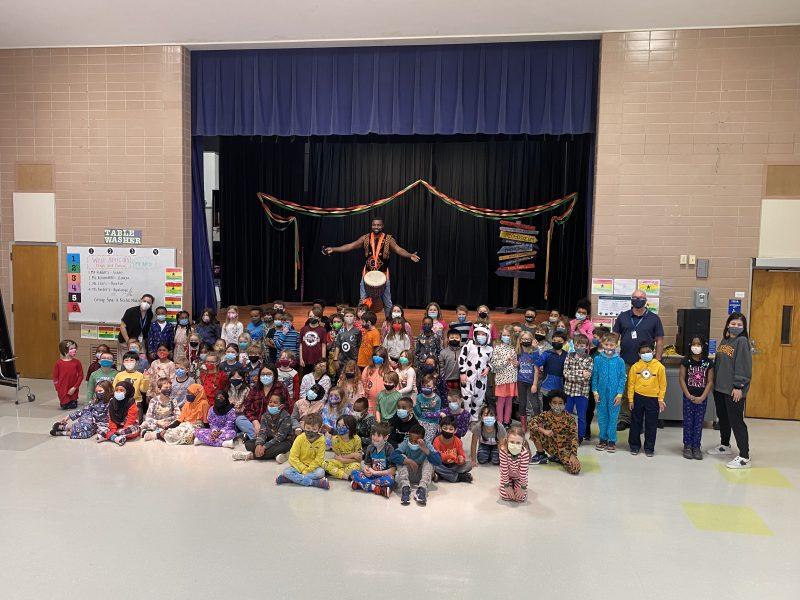 Second grade (and some lucky first grade) SAP Elementary students
spent the last week of March learning about Ghana and trying West
African dance and music with artist-in-resident Christian Adeti. (The
day this photo was taken was also Pajama Day for all students. Photo
courtesy of Karen Duke.