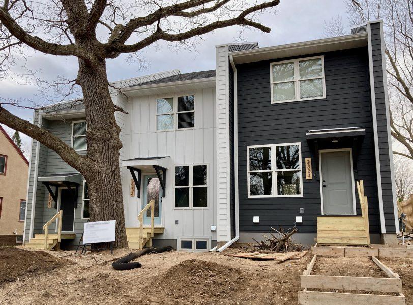 Three townhouses are nearing completion on a street in St. Anthony Park. Where previously one house may have stood, now there are three homes. This builder had to get a variance, which added time and probably cost to the project, while under the proposed new zoning these homes could be done by right. Photo by Pat Thompson.