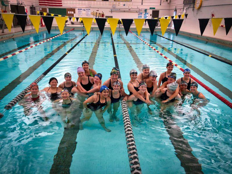 Photo cutline:
Members of the swim team gathering in the pool. Photo by Christina Ward.
