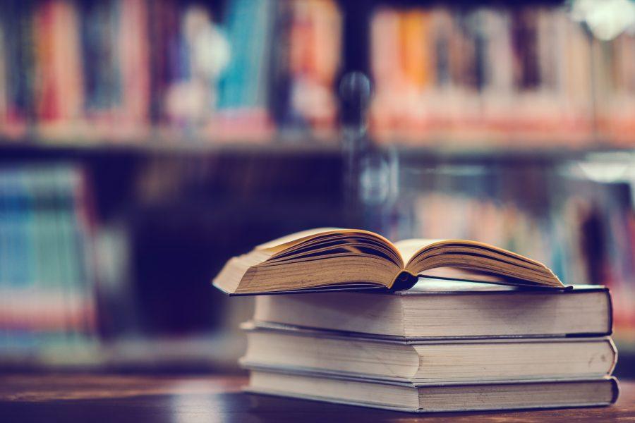 Book in library with open textbook,education learning concept