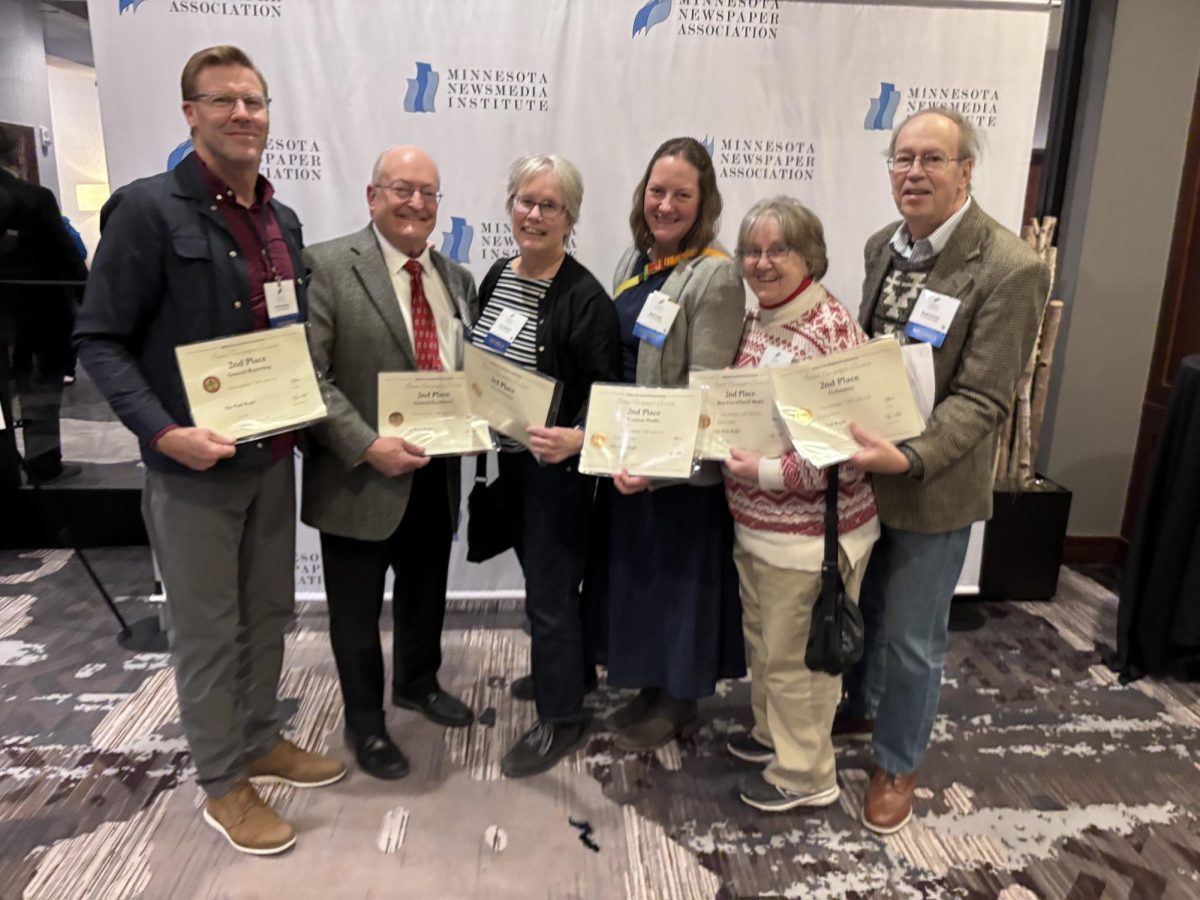 The Park Bugle won several awards at the Minnesota Newspaper Association's Better Newspaper Contest. Pictured are (left to right): Eric Erickson, Steve Plagens, Anne Holzman, Sarah CR Clark, Betsy Carlson and Scott Carlson. Submitted photo.