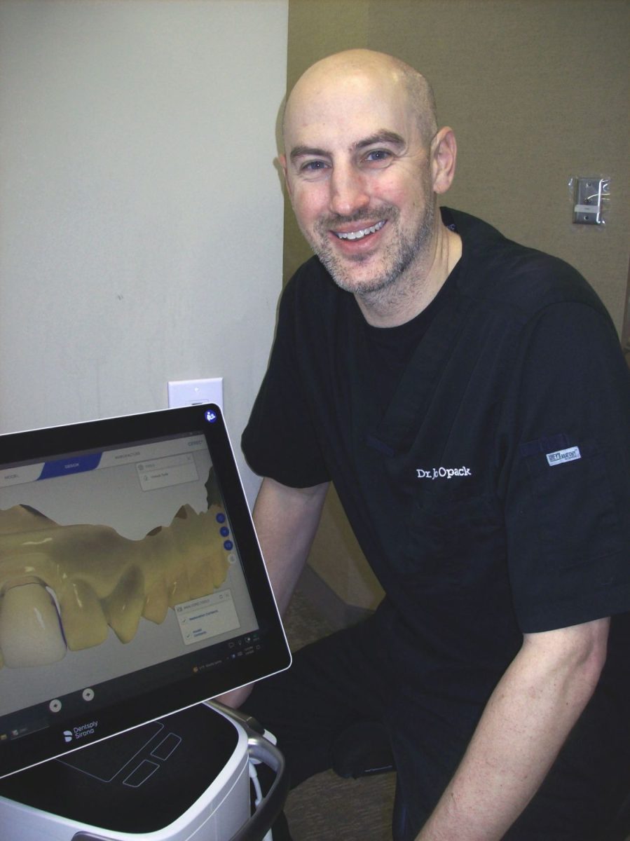 Dr. Joseph Opack of St. Paul Family Dentistry with an example of digital dentistry.