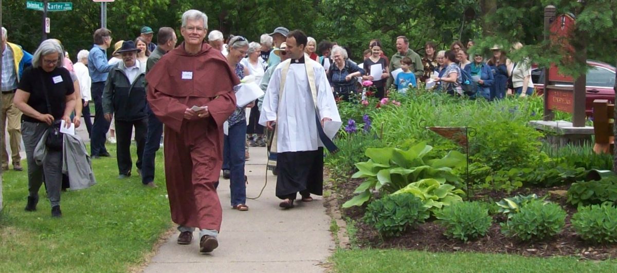 Wearing a friar’s robe, Dan White took on the persona of Saint Anthony to lead the St. Anthony Park Faith Communities Moveable Feast Procession.